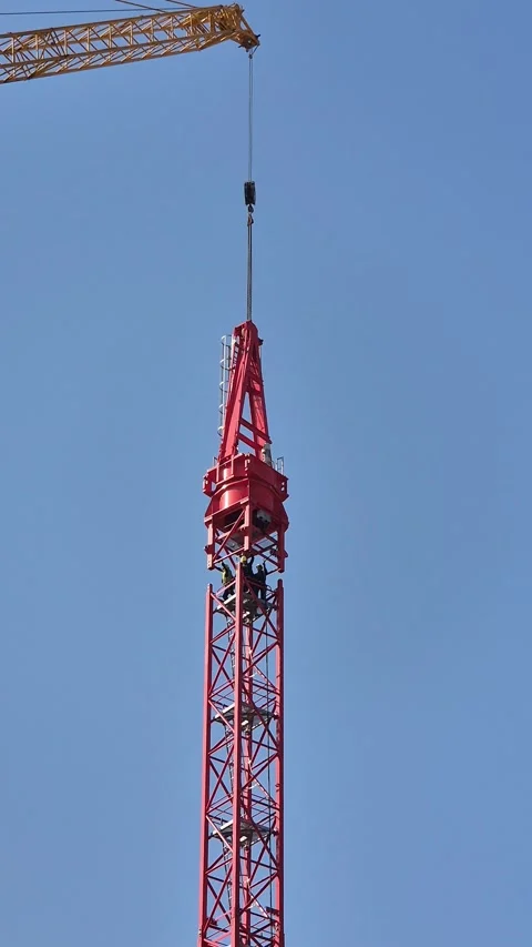 Slow Motion of Workers Hands Guiding Massive Crane Section Stock-Footage 334599663