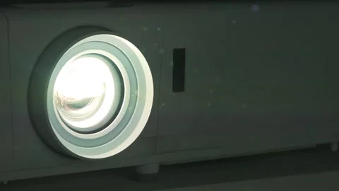Slow Motion Working movie projector. Dust in cinema hall is visible in rays Stock Footage 281789659