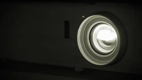 Slow Motion Working movie projector. Projector in operation. Dust in cinema hall Stock Footage 284435549