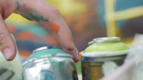Slow motion of writers hand picking spray can 스톡 동영상 51725017