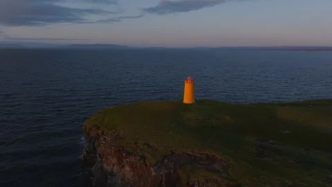 Slow motion of Yellow lighthouse, Icelandic beauty at dusk Stock Footage 330897112