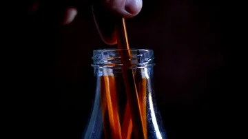 Slow motion yellow pencils being picked up in a school by a student, glass jar  Stock Footage 85678931