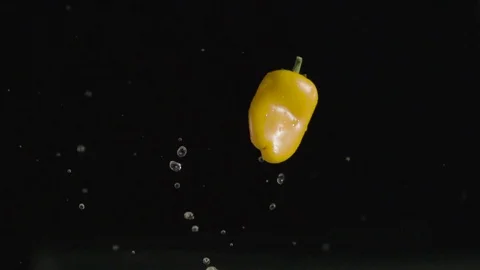 Slow Motion Yellow Pepper High Flip With Water Splash 스톡 동영상 71442693