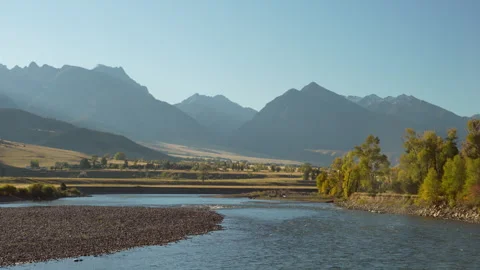 Slow motion Yellowstone River Flowing on Autumn Morning light Stock Footage 317863269
