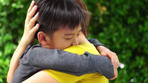 Slow motion young Asian boy hug his mom Stock Footage 90242214