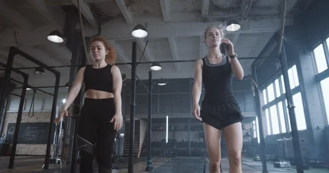 Slow motion young beautiful athletic blonde woman working out together with Video stock 116881452