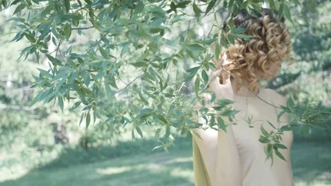 Slow motion. Young beautiful model posing in forest. Photo session. Fashion. Stock Footage 76293297
