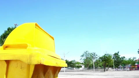 Slow motion young boy drink water from a bottle and drop in a bin 库存影片 89485965