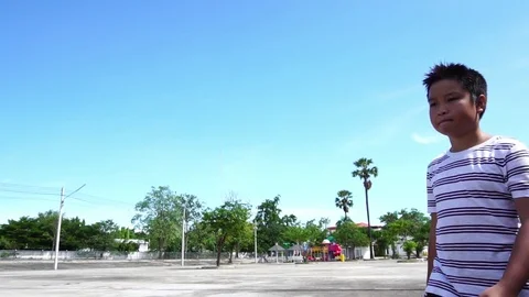 Slow motion young boy drink water from a bottle and drop in a bin Stock Footage 90242052