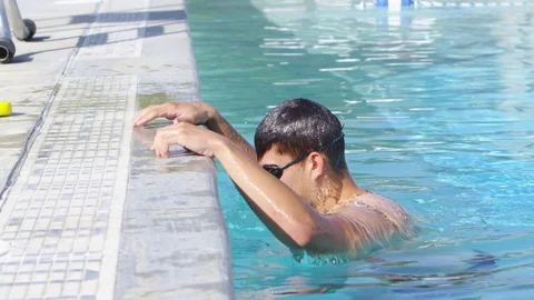Slow motion young boy getting out of a pool Stock-Footage 80134212