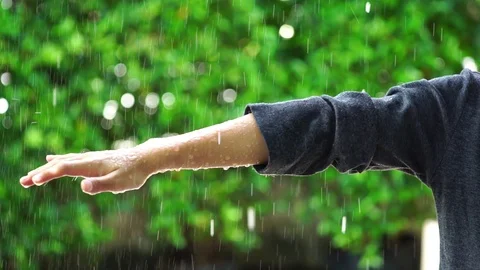 Slow motion young boy hand under the rain Stock Footage 90507914