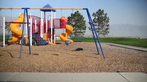 Slow motion young boy at park playground by himself, skateboarding Stock Footage 94930306
