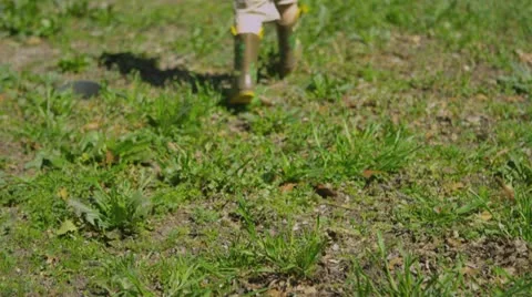 (Slow Motion) Young boy plays in the yard 2 Stock Footage 22050371