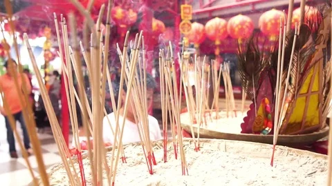 Slow motion young boy pray at chinese temple with incease stick-1 Stock Footage 90242216