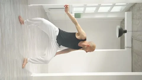 Slow motion of young choreographer demonstrates elements of modern dance on Stock Footage 159856191