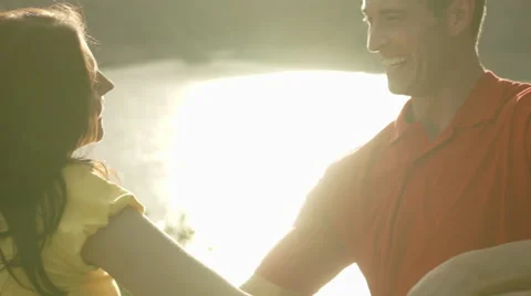 Slow motion young couple dancing and hugging by overlooking lake. Video stock 43667348