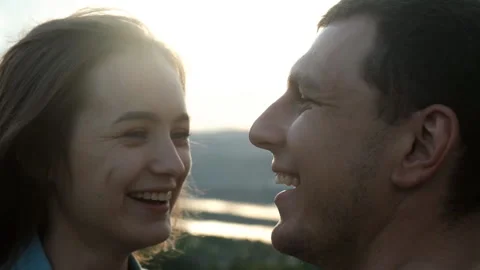 Slow motion of a young couple having fun and kissing at sunset. Stock Footage 111097138