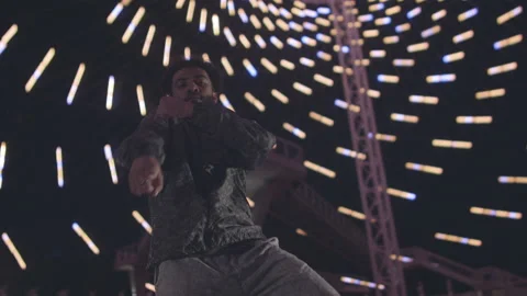 Slow motion of young islamic hip hop guy dancing in room with abstract lights Stock Footage 211870040