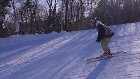 SLOW MOTION Young Male doing Flat 3 grab (Side/Back Flip) off Jump on Skis Stock Footage
