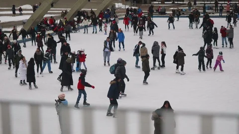Slow motion of young man falling down in ice skating rink Stock Footage 114997615