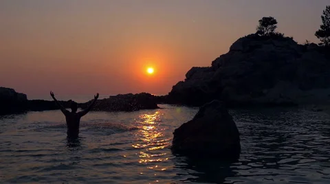 Slow motion - Young man raising hands and splasing water over himself Stock Footage 56970685