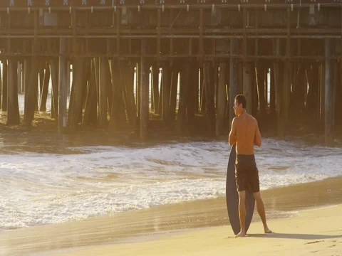 Slow motion of a young man skimboarding. Stock Footage 73337557