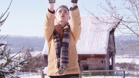 Slow motion young man throwing snow up in the air 스톡 동영상 80128417