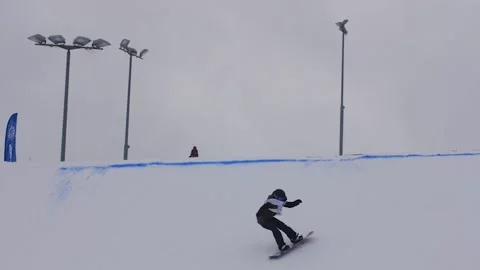 SLOW MOTION: Young pro snowboarder big air Stock Footage 144494941