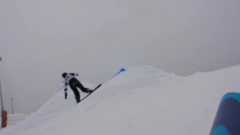 SLOW MOTION: Young pro snowboarder big air Stock Footage 144496701