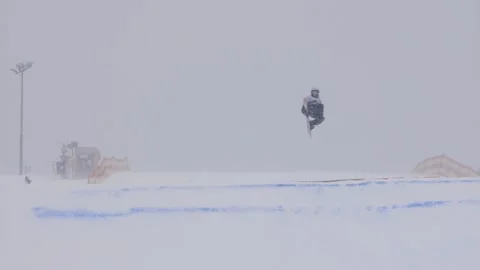 SLOW MOTION: Young pro snowboarder big air Stock Footage 144497463