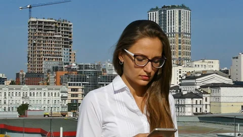 Slow motion. Young serious long-hair business woman  in office zone Video stock 97148480