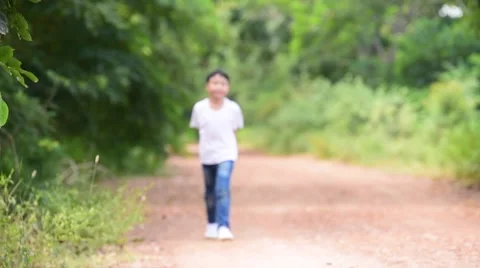 Slow motion young Thai boy run Stock Footage 68829096