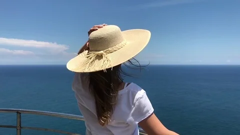 Slow Motion. Young Woman In Hat Looks At The Sea Stock Footage
