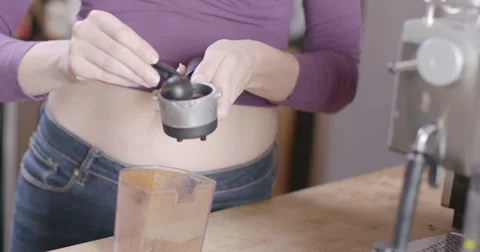 Slow motion young woman's hands measuring espresso in kitchen 4K Stock Footage 61838550
