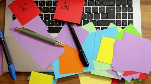 Slow motion zoom of colored sticky papers on laptop Stock Footage 293049142