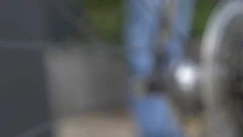 Slow motion zoom into moving bicycle wheel and gear chain cogs, low depth Stock Footage 107317839