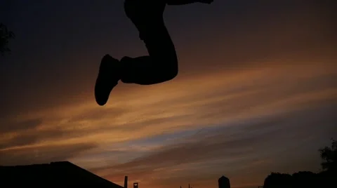 Slow motion:Child jump in the sunset Stock Footage 51443368