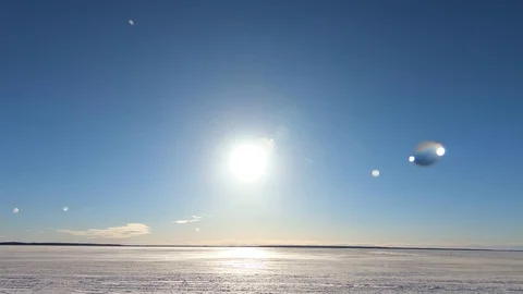Slow motion.Drop of water drops against a background of bright sun and blue sky. Stock Footage 87561876