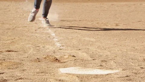 Slow motiong softball player sliding into home plate 스톡 동영상 80133883