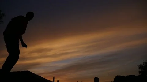 Slow motion:young man jump in the sunset Stock Footage 51462474