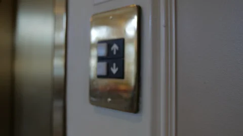 Slow move in to elevator button Stock Footage