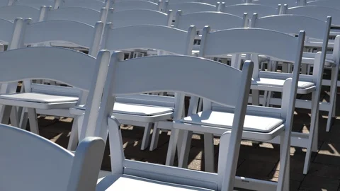 Slow move over side of white wedding chairs Stock Footage 114185920