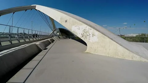 Slow movement acros the cable-stayed concrete bridge in a sunny day Stock Footage 49058594