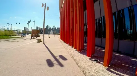Slow movement along the bright colored walls of a modern building in sunny day Stock Footage 49058321