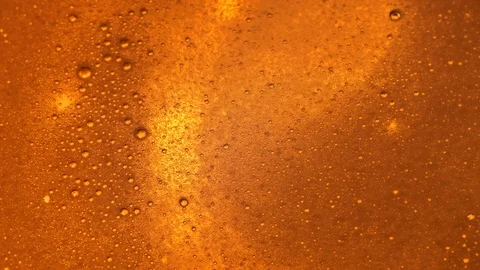 Slow Movement of Beer Bubbles with Foam Stock Footage 125462864