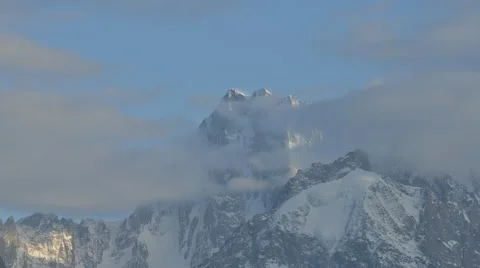 Slow movement of clouds over mountains in the Alps Stock Footage 61819618