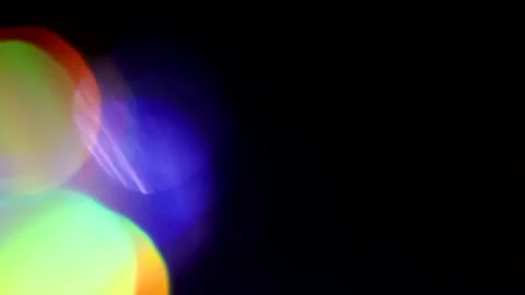 Slow movement of colored light on the left in the dark Vidéo 309427212