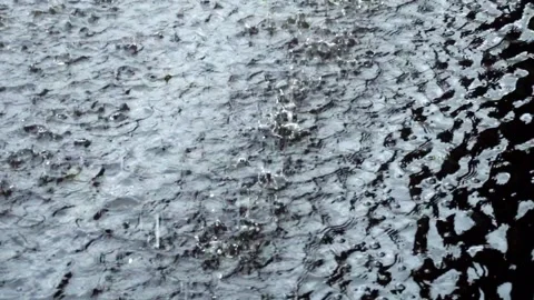 Slow movement of large water with rain falling and falling on the surface o.. Stock-Footage 304494249