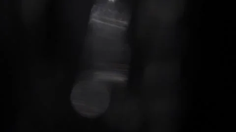 Slow movement to the left of white light on a black screen 스톡 동영상 318586645