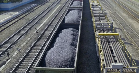 Slow Movement of Wagons Train on Rails. Freight Wagons Filled With Fossil Fuels Stock Footage 136717276